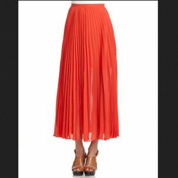 orange pleated maxi skirt